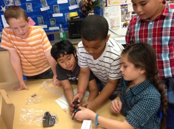 Students work together to assemble the radios.